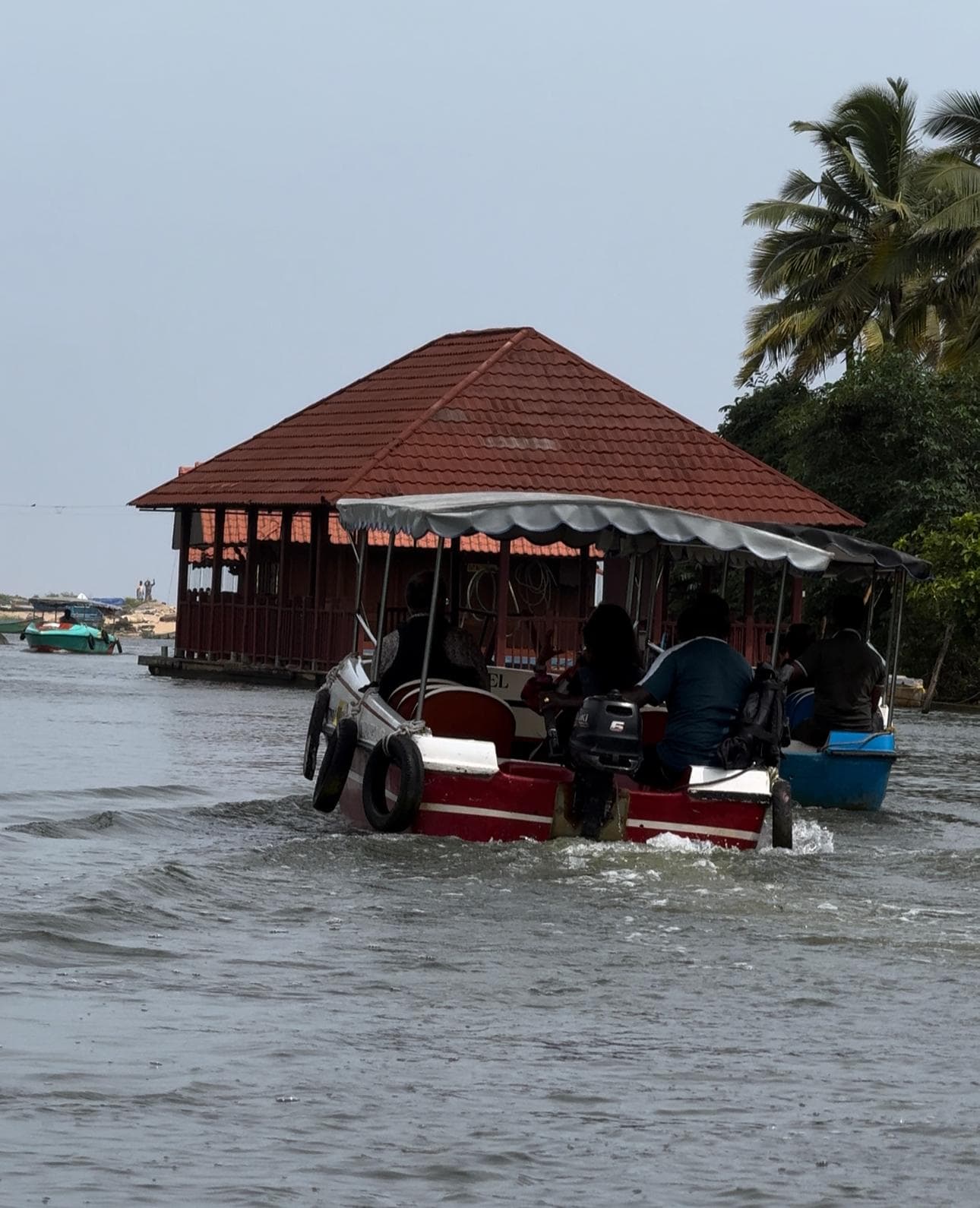 Poovar Island golden sandbar at low tide — narrow strip of sand separating the backwater lagoon from the open Arabian Sea, Kerala
