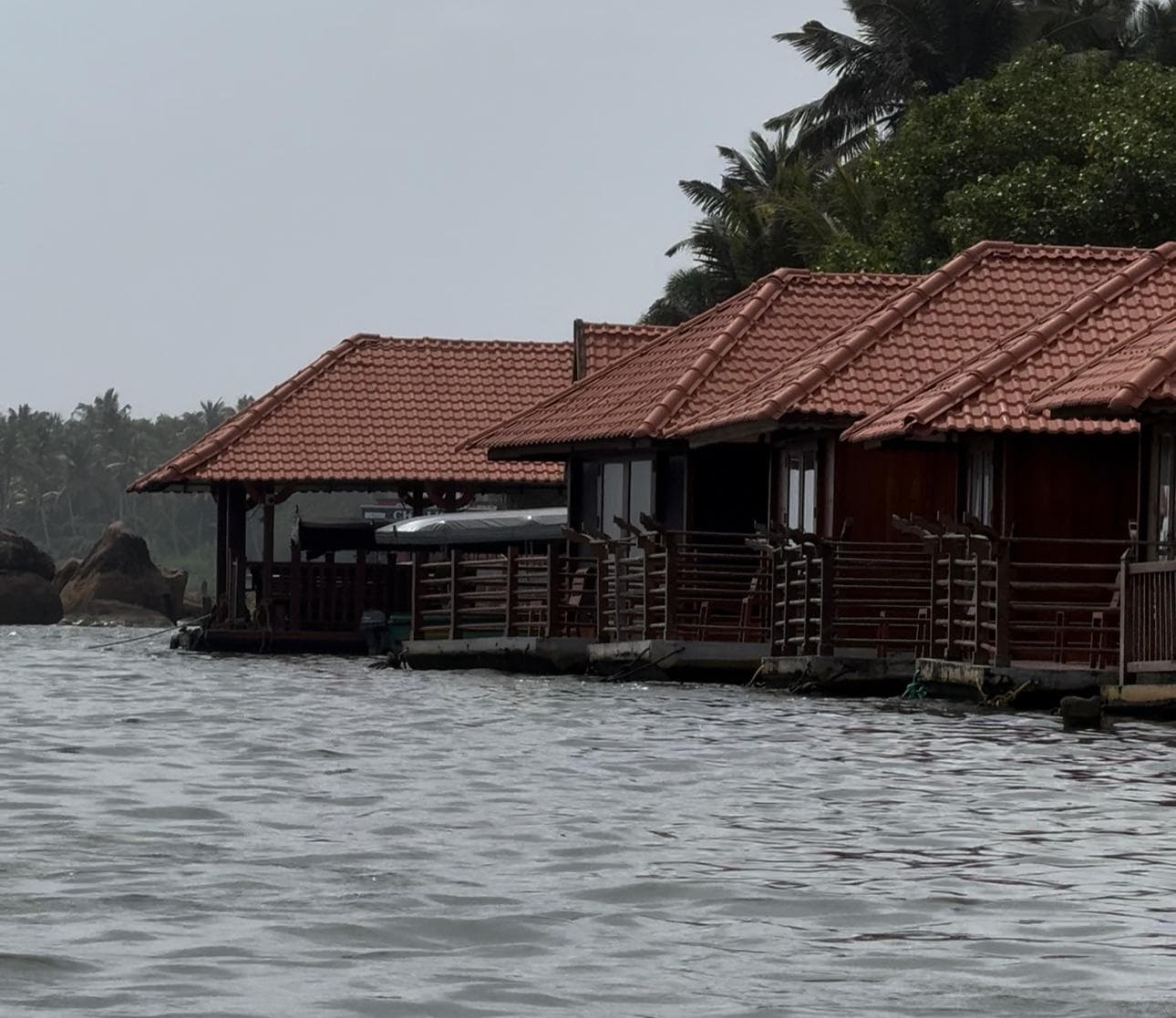 The lagoon opens up — brackish water, fishing boats, the first view of Poovar Island