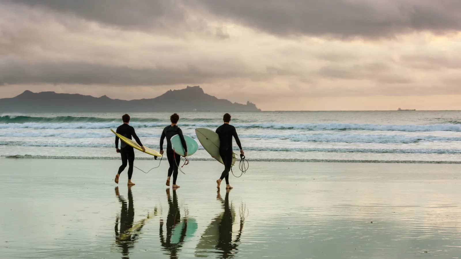 Adventure activities in Kovalam including surfing, sailing, and parasailing along the Arabian Sea coastline