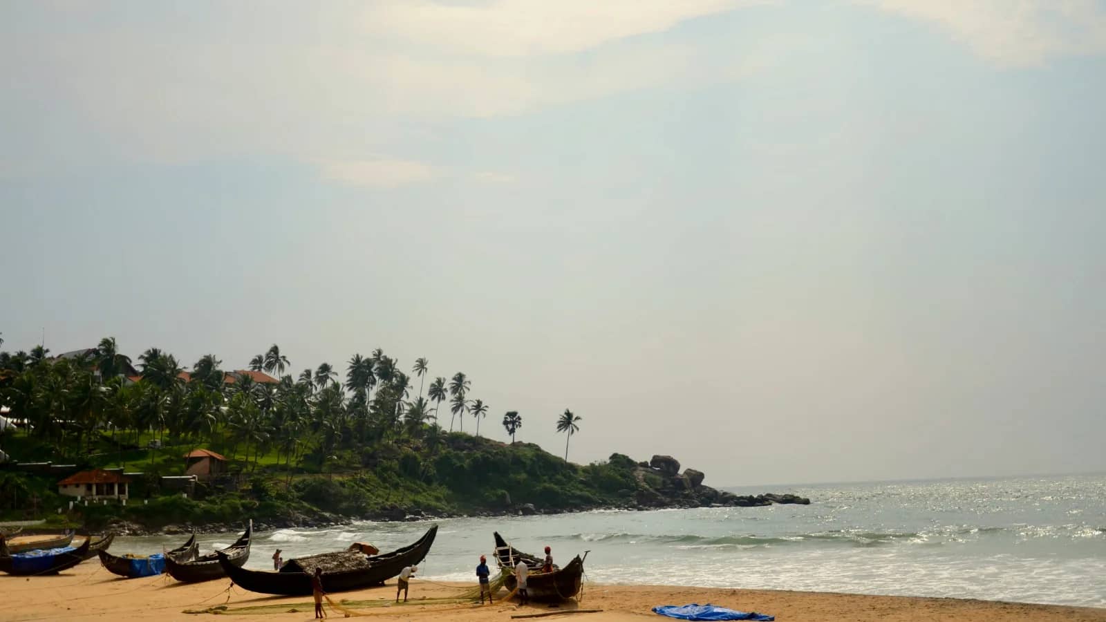 Evening walk and sunset along the Kovalam promenade with Arabian Sea views, beachside atmosphere, and golden hour scenery