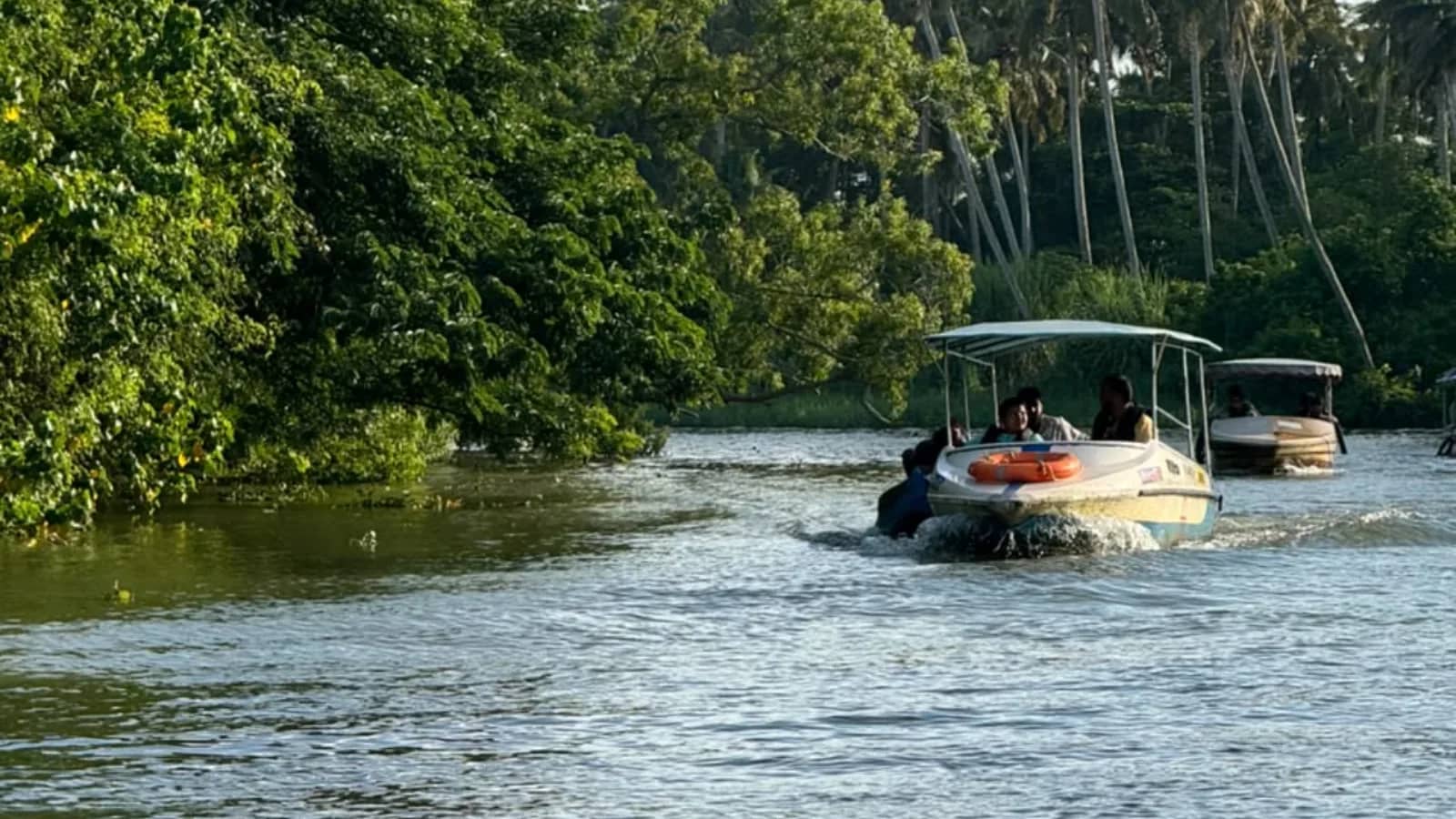 Poovar Backwaters and Azhimala Shiva Temple near Kovalam featuring mangrove waterways, backwater boating, coastal landscapes, and the iconic Shiva statue